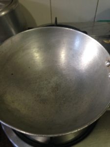 Now in a thick bottomed pan or wok put the coconut milk and let it come to a boil. If you think it is too thick, dilute it with a little water.